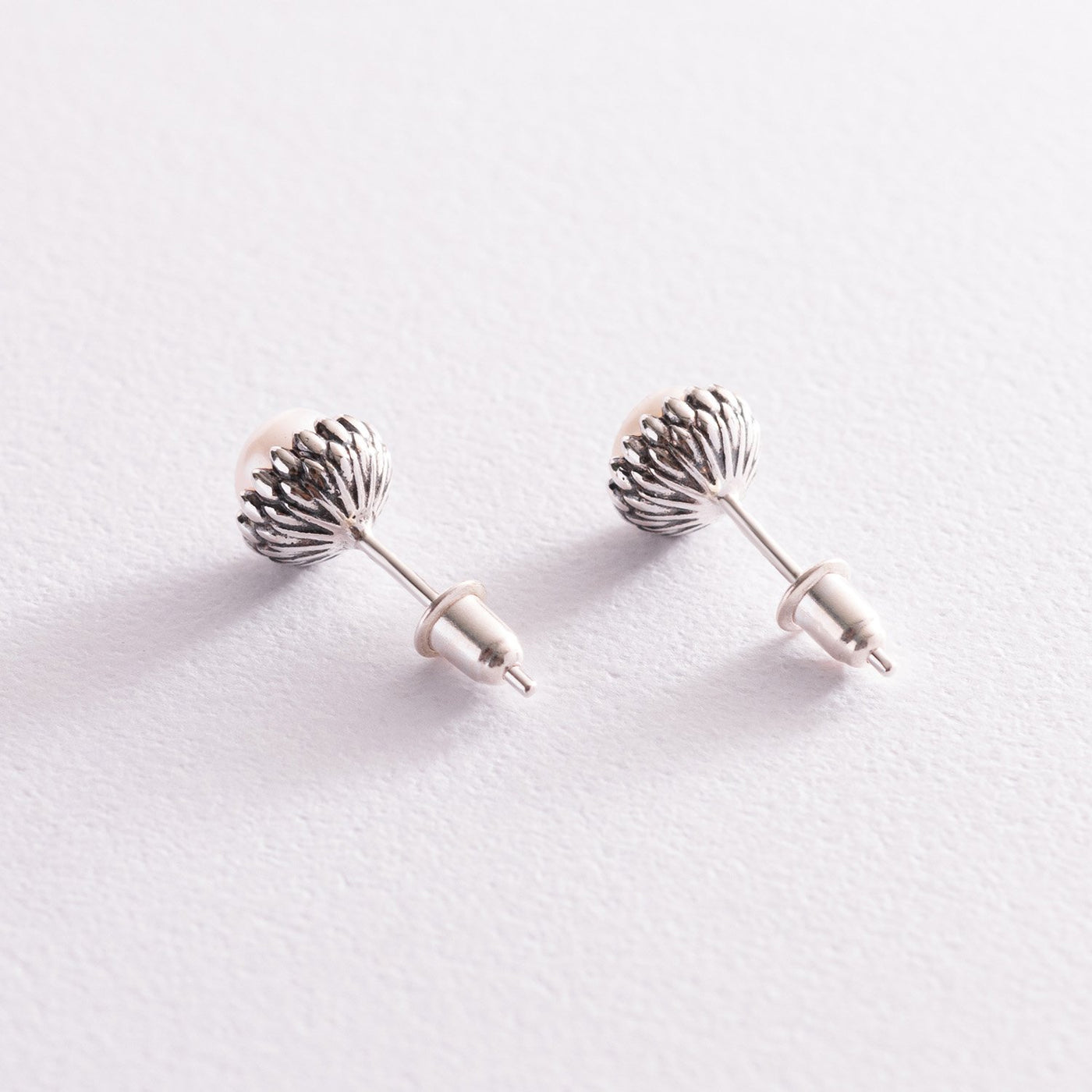 Silver stud earrings with pearls