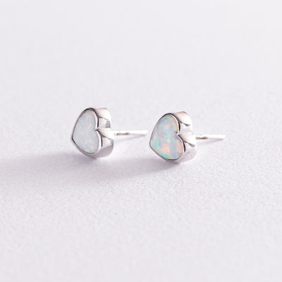 Gold heart stud earrings with opal