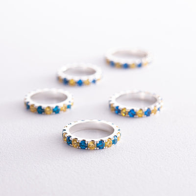 Ring with a path of blue and yellow cubic zirconia