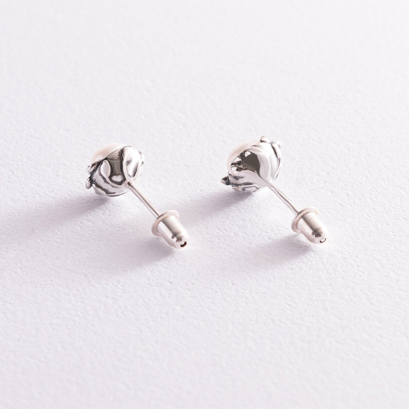 Silver stud earrings with pearls