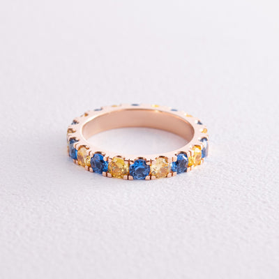 Ring with a path of blue and yellow cubic zirconia