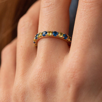 Ring with a path of blue and yellow cubic zirconia