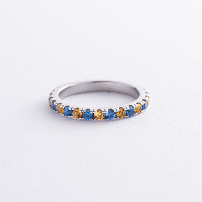 Ring with a path of blue and yellow cubic zirconia