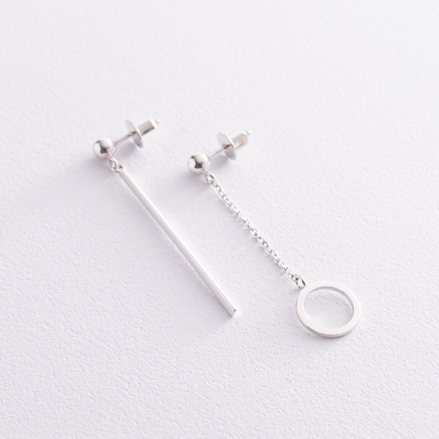 Silver asymmetrical earrings