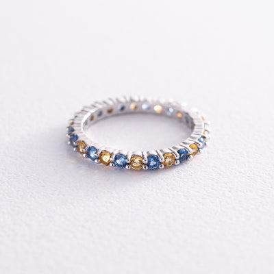 Ring with a path of blue and yellow cubic zirconia